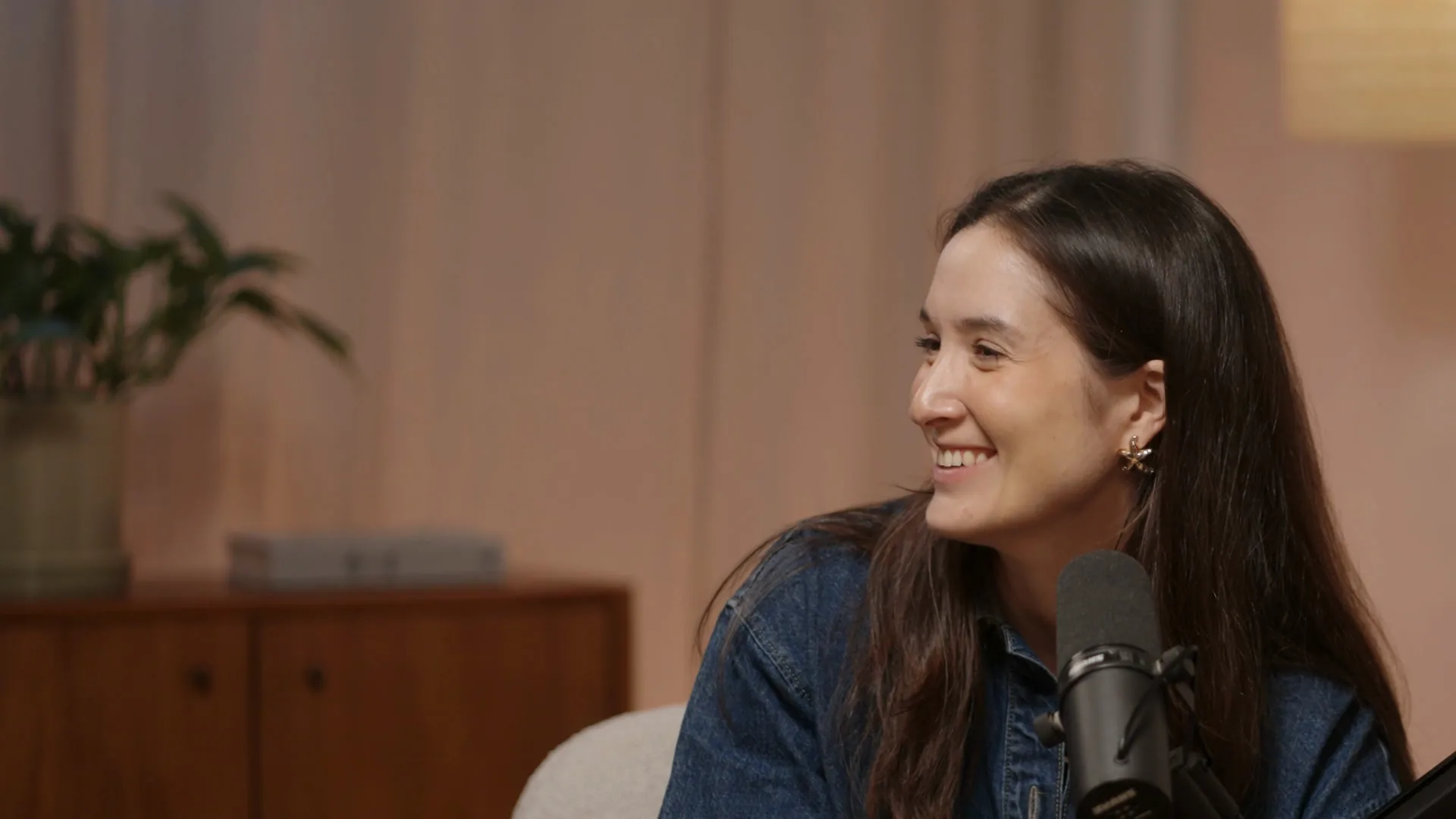 Lottie Unwin, founder of LOUD, laughing between takes in the studio